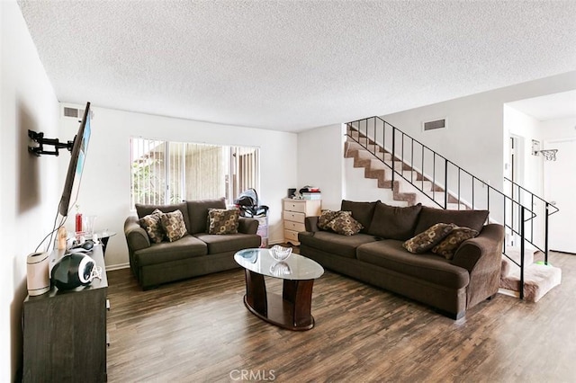 121 E Live Oak St, San Gabriel, CA 91776 - living area featuring wood finished floors, stairs, and a textured ceiling