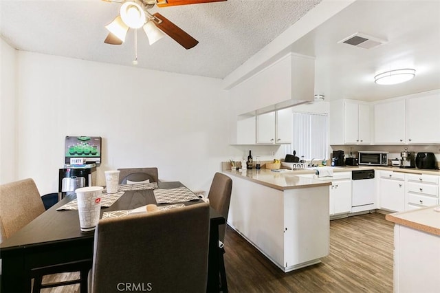 121 E Live Oak St, San Gabriel, CA 91776 - kitchen featuring stainless steel microwave, dishwasher, a ceiling fan, a peninsula, and dark wood-style flooring