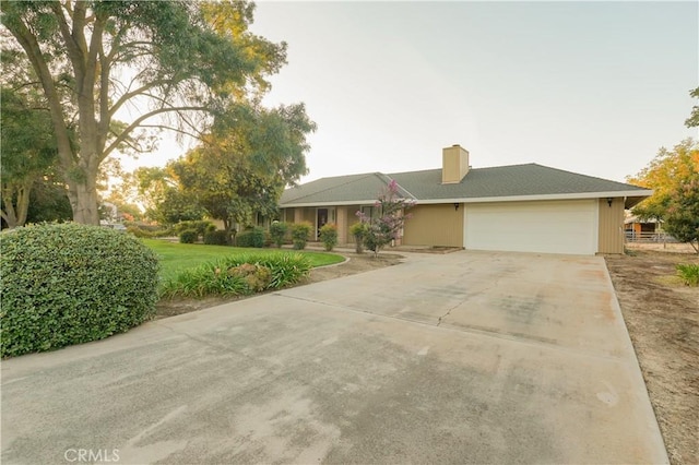 5030 Cardiff Ln, Atwater, CA 95301 - view of front of property with a garage, driveway, a chimney, and a front yard