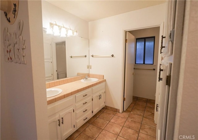 5030 Cardiff Ln, Atwater, CA 95301 - full bathroom featuring double vanity and tile patterned floors