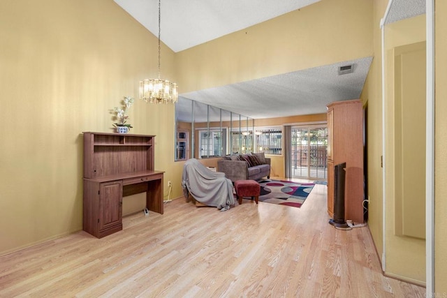 1518 Goldrush Way, Oceanside, CA 92057 - living room with light wood finished floors, a chandelier, and high vaulted ceiling