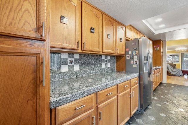 1518 Goldrush Way, Oceanside, CA 92057 - kitchen with stainless steel refrigerator with ice dispenser, tile countertops, decorative backsplash, and brown cabinetry