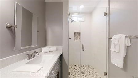 6008 Amos Ave, Lakewood, CA 90712 - full bathroom with vanity and a stall shower