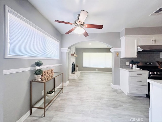 6008 Amos Ave, Lakewood, CA 90712 - hall featuring arched walkways and baseboards