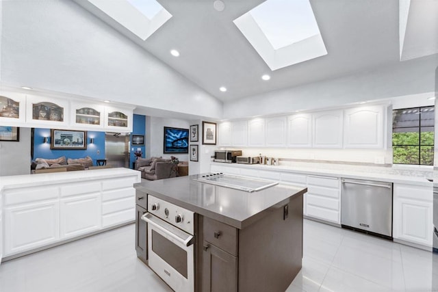 19 Gateview Dr, Fallbrook, CA 92028 - kitchen featuring stainless steel dishwasher, a skylight, white oven, black electric cooktop, and lofted ceiling