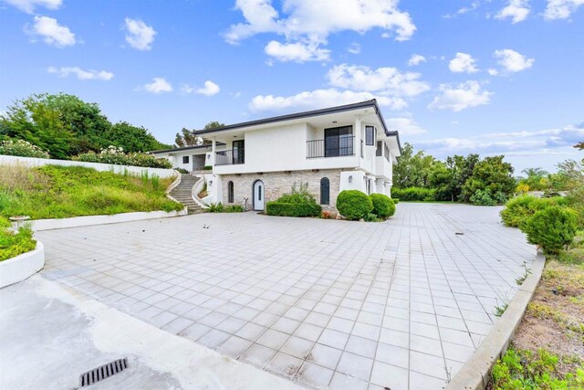 19 Gateview Dr, Fallbrook, CA 92028 - view of front of house featuring stairs, stucco siding, and a balcony