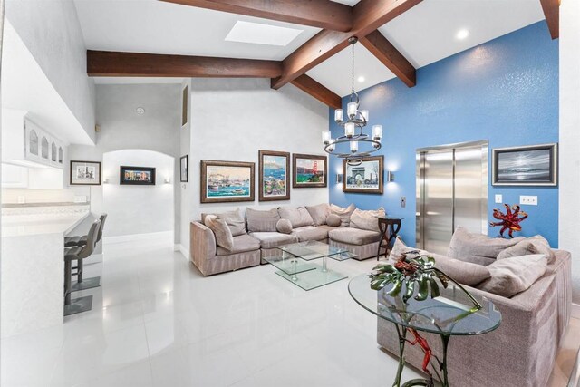 19 Gateview Dr, Fallbrook, CA 92028 - tiled living room with elevator, a skylight, beam ceiling, a chandelier, and high vaulted ceiling