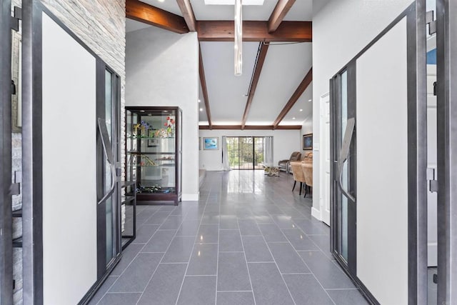 19 Gateview Dr, Fallbrook, CA 92028 - corridor with beam ceiling, a towering ceiling, dark tile patterned floors, baseboards, and recessed lighting