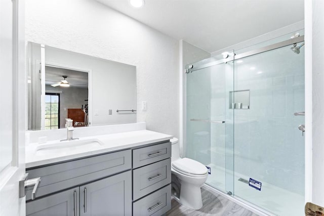 19 Gateview Dr, Fallbrook, CA 92028 - bathroom with vanity, a shower stall, toilet, and ceiling fan