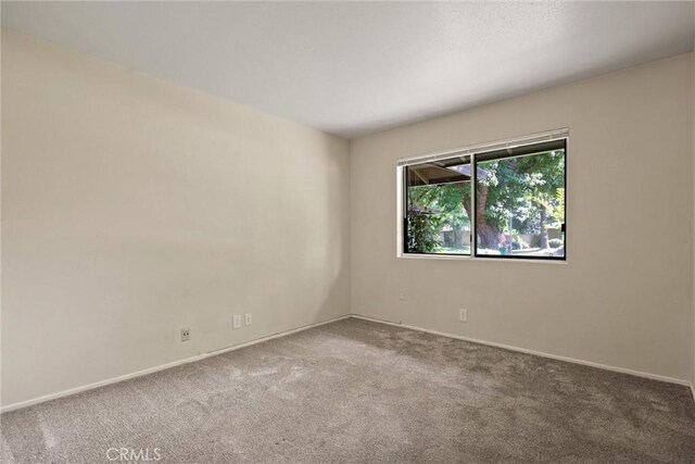 1018 Greenwich Dr, Chico, CA 95926 - spare room featuring carpet and baseboards