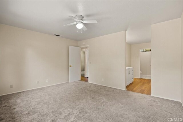 1018 Greenwich Dr, Chico, CA 95926 - empty room featuring light carpet, a ceiling fan, and baseboards
