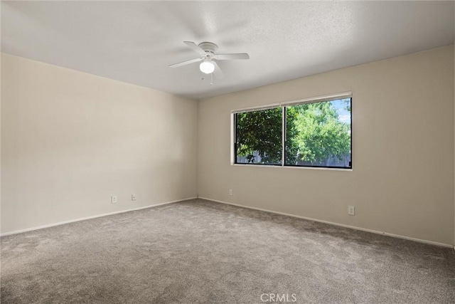 1018 Greenwich Dr, Chico, CA 95926 - carpeted spare room featuring a ceiling fan and baseboards