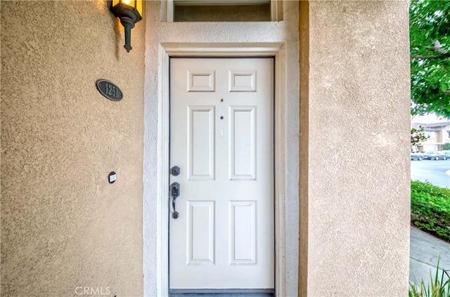 1251 Pepperwood Ct, Carson, CA 90746 - view of exterior entry featuring stucco siding
