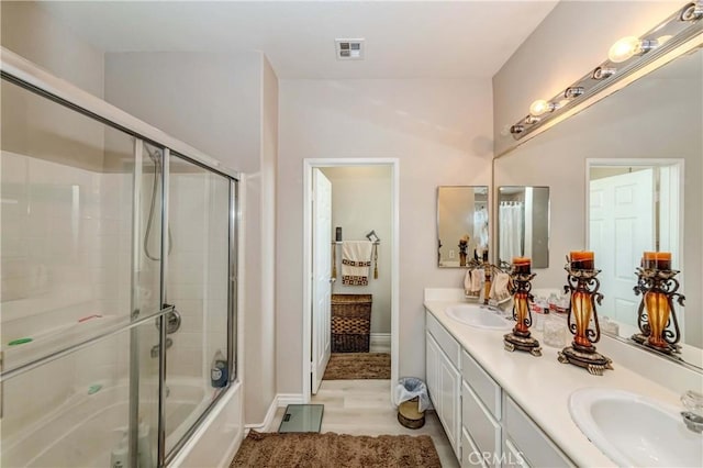 1251 Pepperwood Ct, Carson, CA 90746 - bathroom featuring double vanity and enclosed tub / shower combo