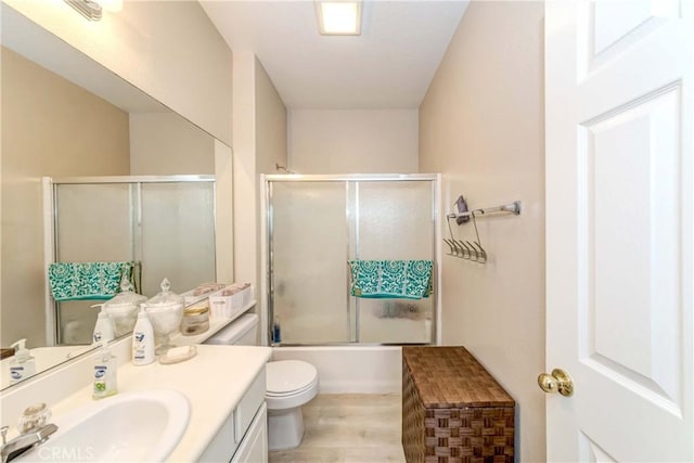 1251 Pepperwood Ct, Carson, CA 90746 - full bathroom with vanity, wood finished floors, and bath / shower combo with glass door