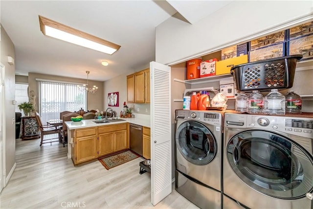 1251 Pepperwood Ct, Carson, CA 90746 - laundry area with independent washer and dryer, a chandelier, and light wood finished floors