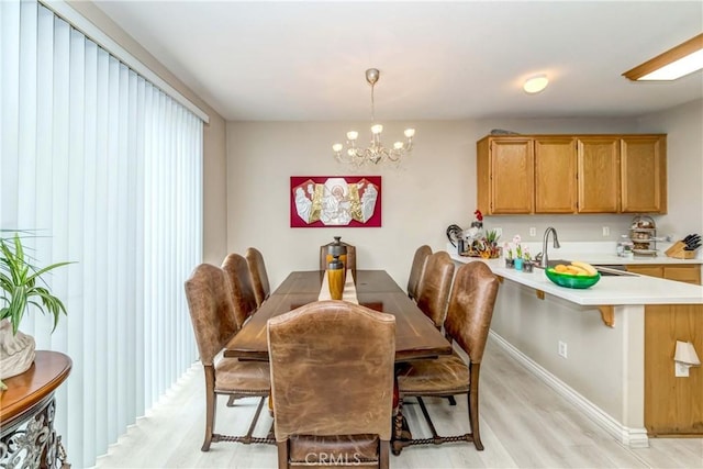 1251 Pepperwood Ct, Carson, CA 90746 - dining space featuring light wood-style floors and a chandelier