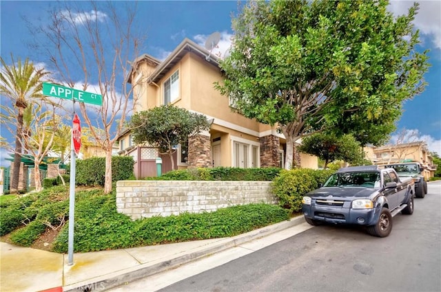 1251 Pepperwood Ct, Carson, CA 90746 - view of front of house featuring stucco siding and stone siding