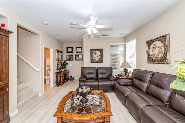 1251 Pepperwood Ct, Carson, CA 90746 - living area featuring ceiling fan, light wood-style flooring, and stairway