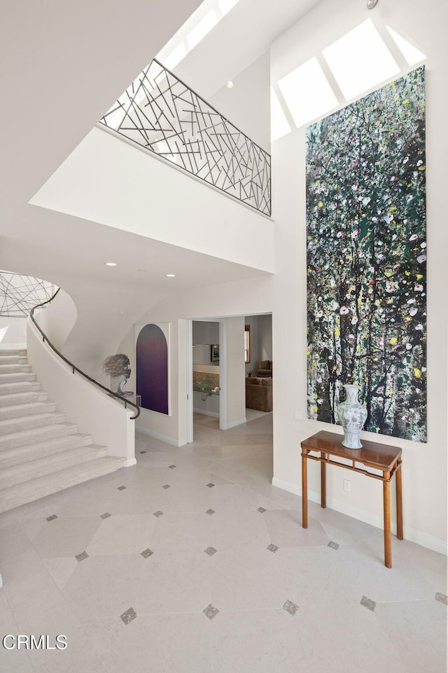 1135 Capri Way, Oxnard, CA 93035 - community lobby with stairway, a towering ceiling, and recessed lighting
