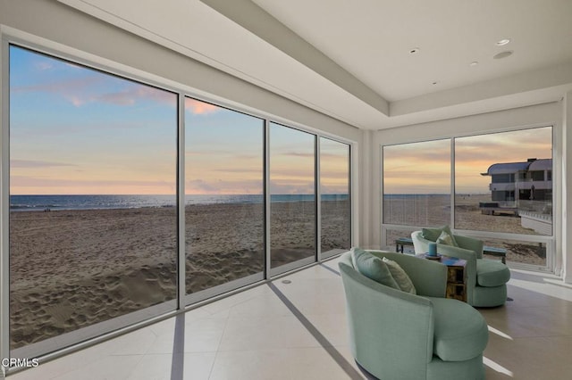 1135 Capri Way, Oxnard, CA 93035 - sunroom / solarium featuring view of water and beach, inlaid floor details, tile patterned floors, recessed lighting, and plenty of natural light