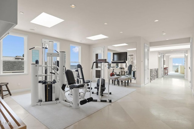 1135 Capri Way, Oxnard, CA 93035 - exercise room with a skylight, light tile patterned flooring, baseboards, healthy amount of natural light, and recessed lighting