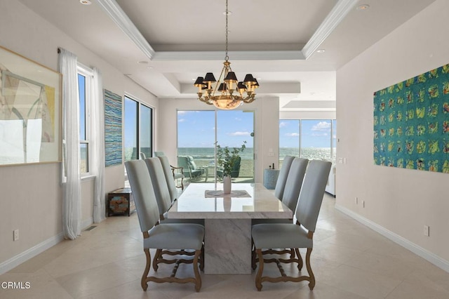 1135 Capri Way, Oxnard, CA 93035 - dining area featuring a chandelier, a tray ceiling, baseboards, light tile patterned floors, and crown molding