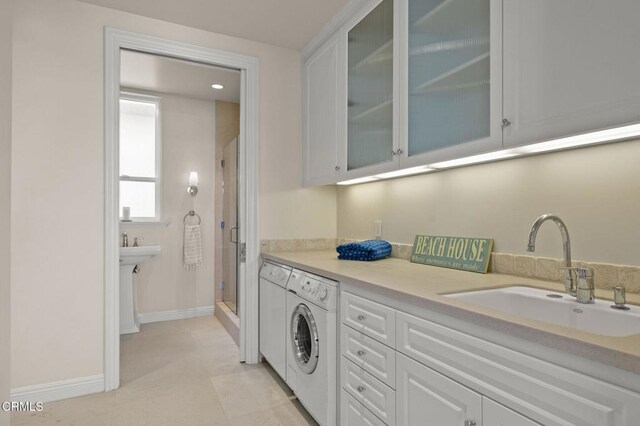 1135 Capri Way, Oxnard, CA 93035 - laundry room with washer / dryer and cabinet space