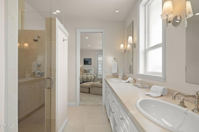 1135 Capri Way, Oxnard, CA 93035 - bathroom featuring a stall shower, double vanity, connected bathroom, recessed lighting, and baseboards
