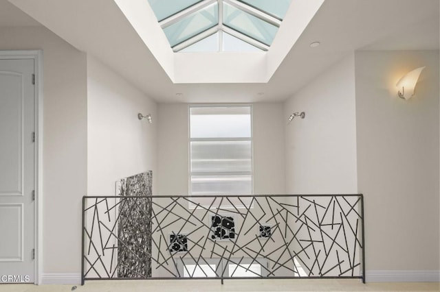 1135 Capri Way, Oxnard, CA 93035 - hall featuring baseboards, a skylight, and an upstairs landing