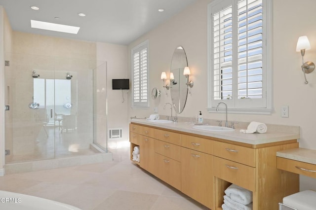 1135 Capri Way, Oxnard, CA 93035 - full bath with a shower stall, double vanity, and a skylight