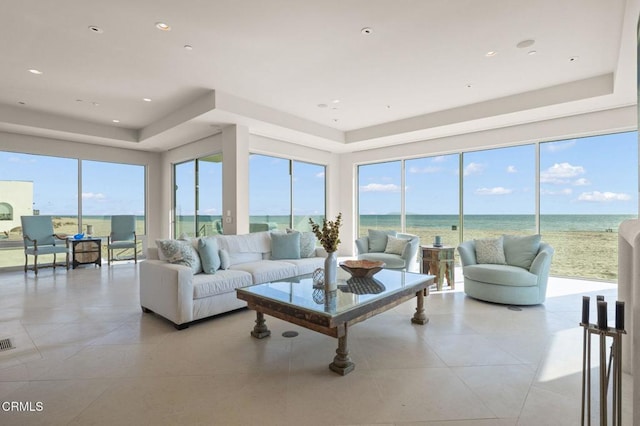 1135 Capri Way, Oxnard, CA 93035 - living area featuring a raised ceiling, light tile patterned flooring, and a water view