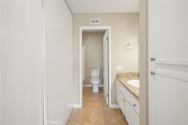 2554 Olive Dr Unit 38, Palmdale, CA 93550 - bathroom with tile patterned flooring, vanity, toilet, and baseboards