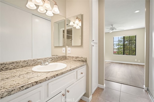 2554 Olive Dr Unit 38, Palmdale, CA 93550 - bathroom featuring vanity, tile patterned flooring, baseboards, and a ceiling fan