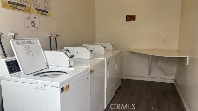 13040 Dronfield Ave Unit 12, Sylmar, CA 91342 - community laundry room featuring washer and clothes dryer, baseboards, and dark wood-style floors