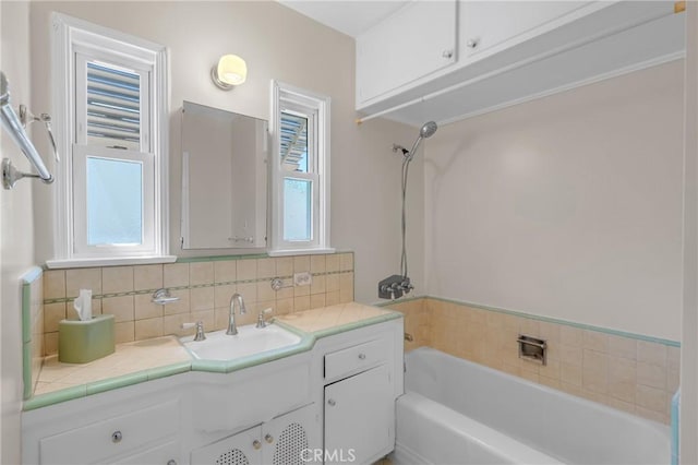 11046 Howard St, Whittier, CA 90606 - bathroom with a bathtub, vanity, and tasteful backsplash