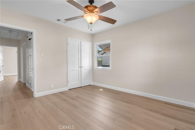 11046 Howard St, Whittier, CA 90606 - unfurnished bedroom featuring attic access, light wood-style flooring, a closet, and ceiling fan