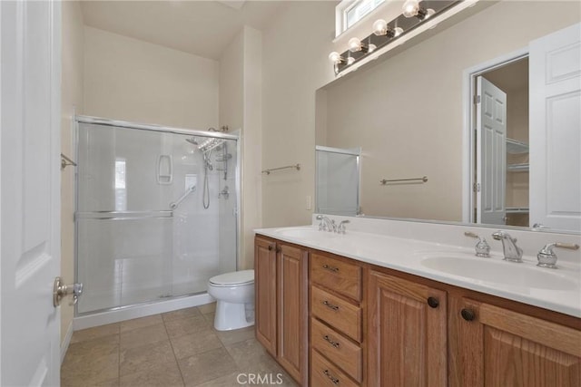 10479 Bridge Haven Rd, Apple Valley, CA 92308 - bathroom with double vanity, a stall shower, toilet, and tile patterned flooring