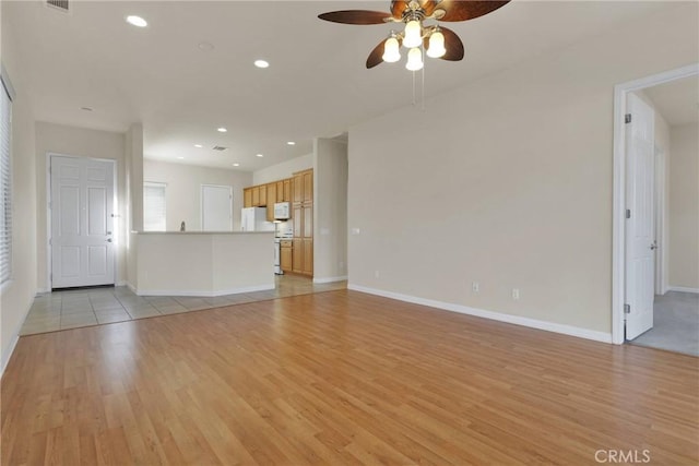 10479 Bridge Haven Rd, Apple Valley, CA 92308 - unfurnished living room featuring light wood finished floors, a ceiling fan, baseboards, and recessed lighting
