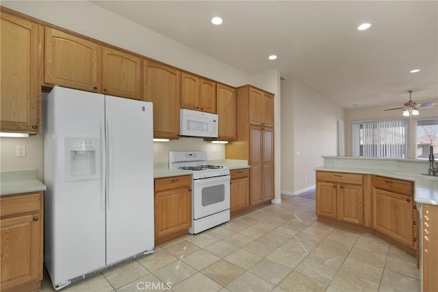 10479 Bridge Haven Rd, Apple Valley, CA 92308 - kitchen featuring white appliances, ceiling fan, light countertops, recessed lighting, and baseboards