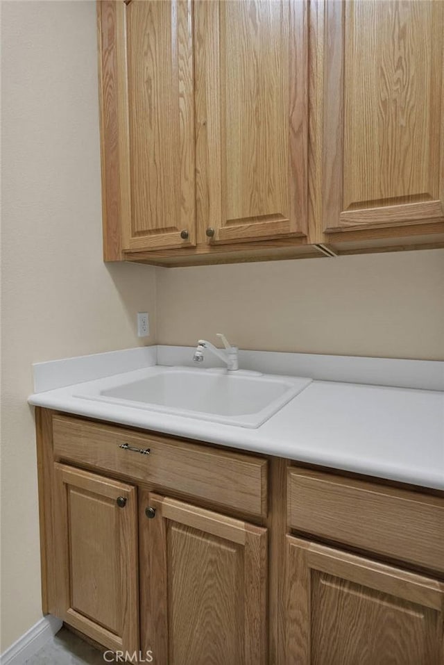 10479 Bridge Haven Rd, Apple Valley, CA 92308 - washroom with a sink and baseboards