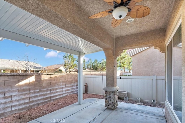10479 Bridge Haven Rd, Apple Valley, CA 92308 - fenced backyard with a patio and a ceiling fan