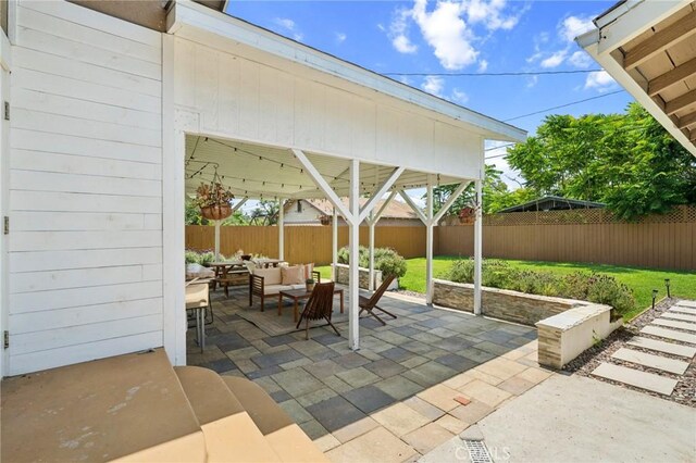 1241 Bresee Ave, Pasadena, CA 91104 - fenced backyard featuring an outdoor living space, a patio, and a gazebo