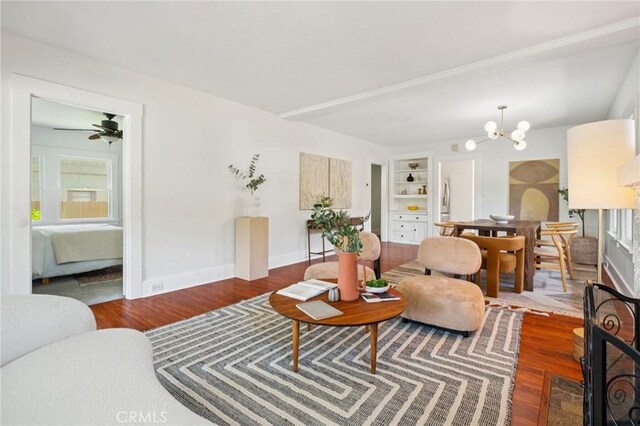 1241 Bresee Ave, Pasadena, CA 91104 - living room with wood finished floors, built in shelves, and a chandelier