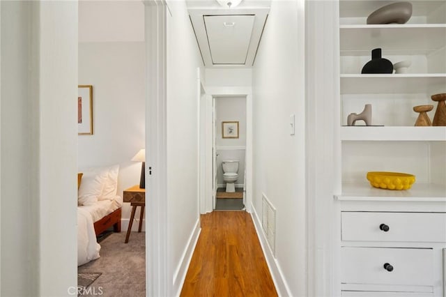 1241 Bresee Ave, Pasadena, CA 91104 - hallway featuring attic access, wood finished floors, and baseboards