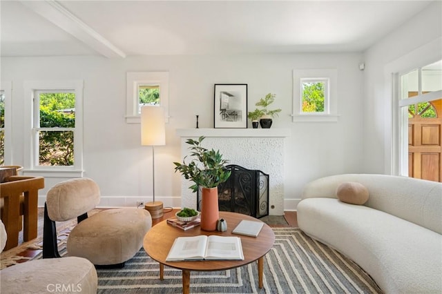 1241 Bresee Ave, Pasadena, CA 91104 - living room featuring plenty of natural light, a tiled fireplace, baseboards, beam ceiling, and wood finished floors