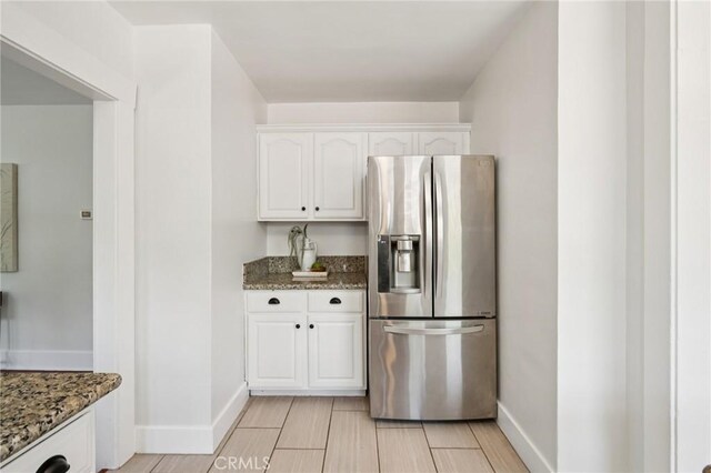 1241 Bresee Ave, Pasadena, CA 91104 - kitchen with stainless steel refrigerator with ice dispenser, stone counters, and white cabinets