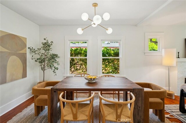 1241 Bresee Ave, Pasadena, CA 91104 - dining area featuring healthy amount of natural light, wood finished floors, and a chandelier