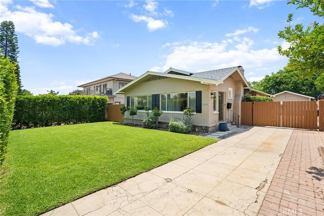 1241 Bresee Ave, Pasadena, CA 91104 - view of front of home featuring concrete driveway, stucco siding, and a gate