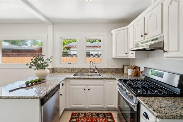 1241 Bresee Ave, Pasadena, CA 91104 - kitchen with stainless steel appliances, under cabinet range hood, a sink, white cabinetry, and light stone counters